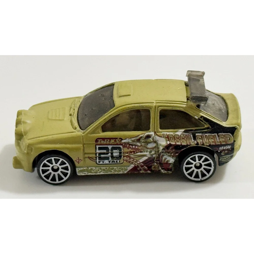 Hot Wheels Escort Rally Kids 1/64 Tan Fossil Fueled T-Rex Dinosaur Car 1996